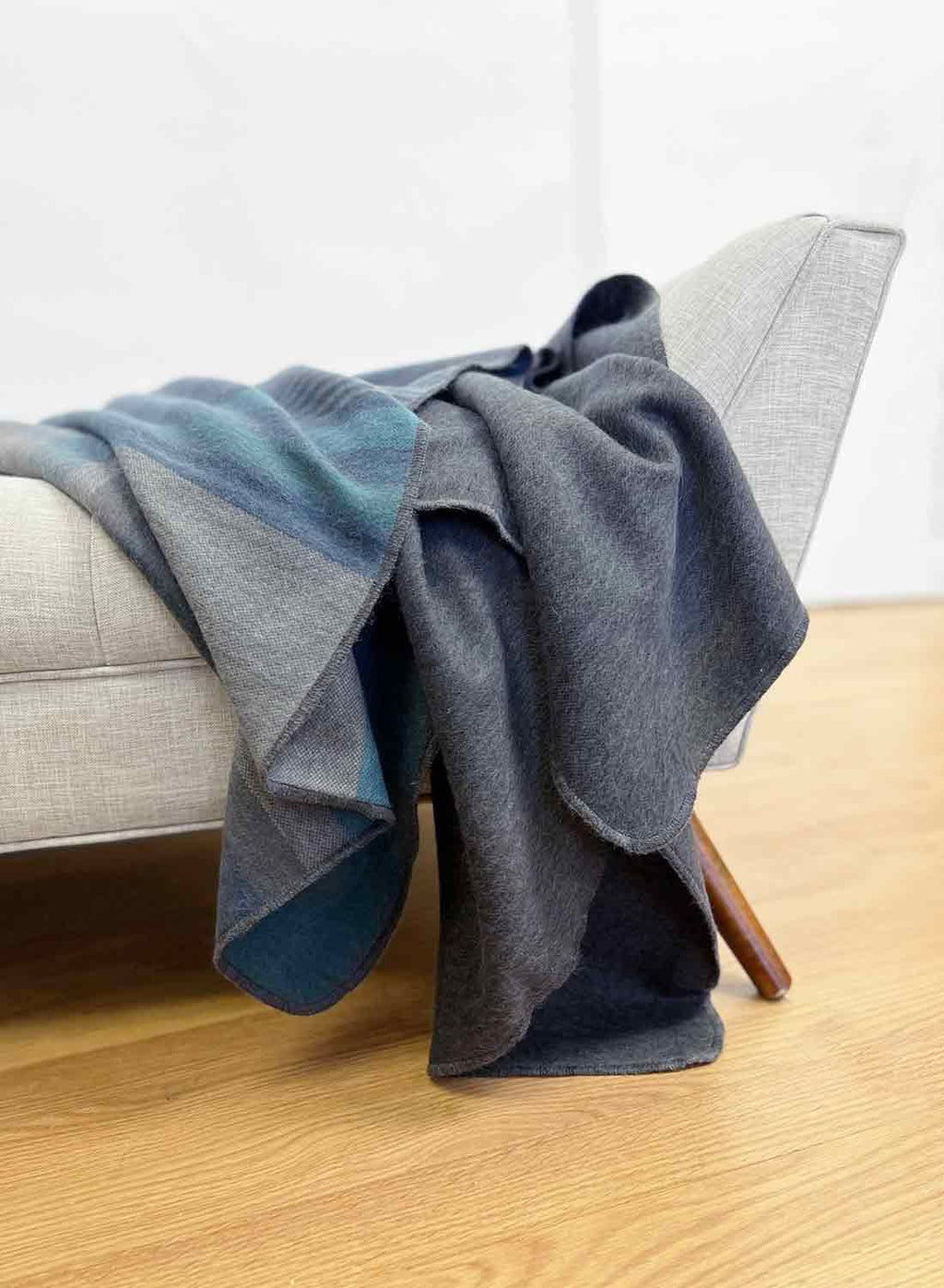 Dark Sea alpaca throw blanket with charcoal and oceanic blue stripes, Shupaca