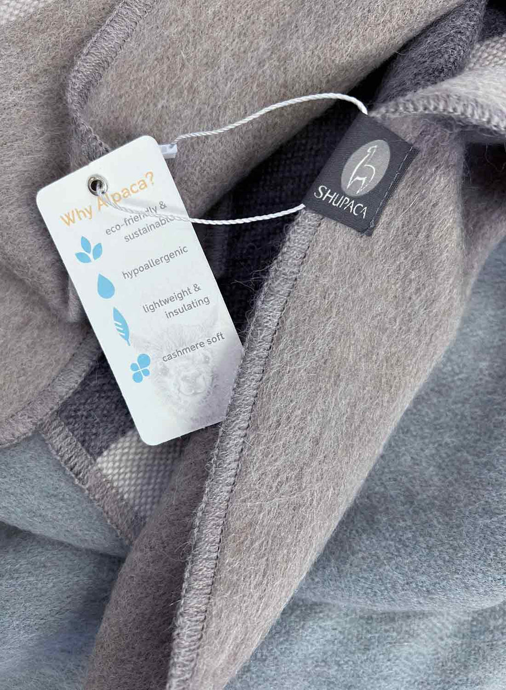 Grey alpaca throw blanket in Silverlake with lake-blue reverse, Shupaca