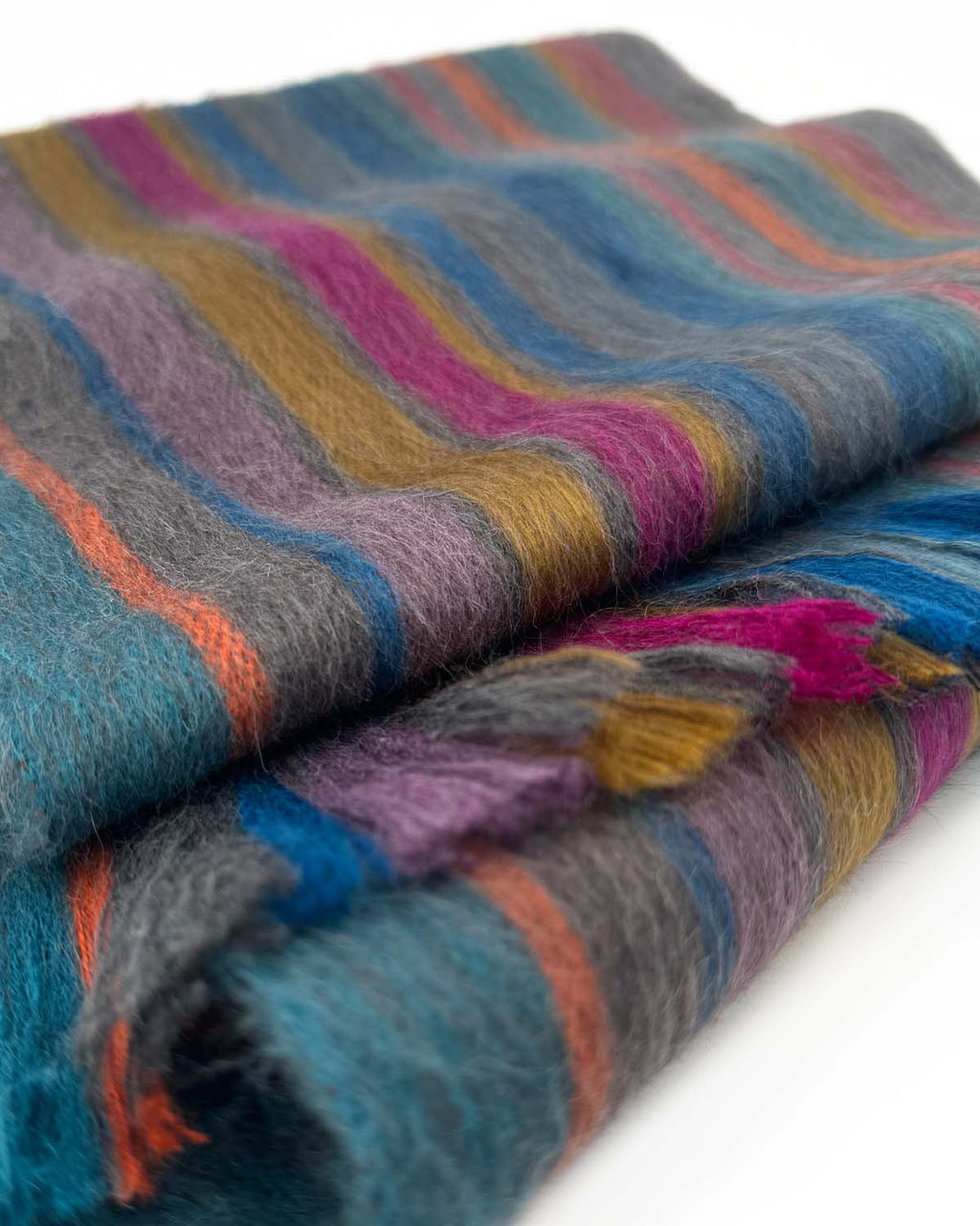Blue alpaca scarf in Jubilee with orange, fuchsia, and gold stripes, Shupaca