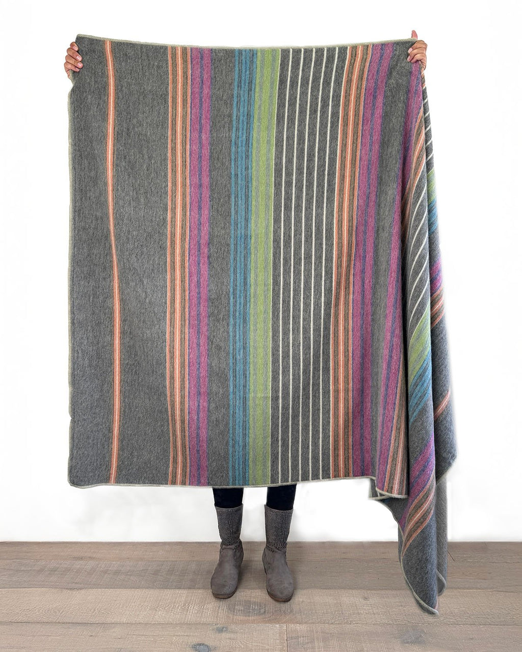 Fireworks alpaca throw blanket with pink, orange, and green stripes, Shupaca