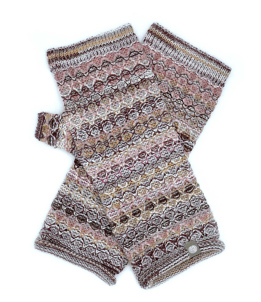 Terracotta alpaca gloves in Canyon with sandstone, Shupaca