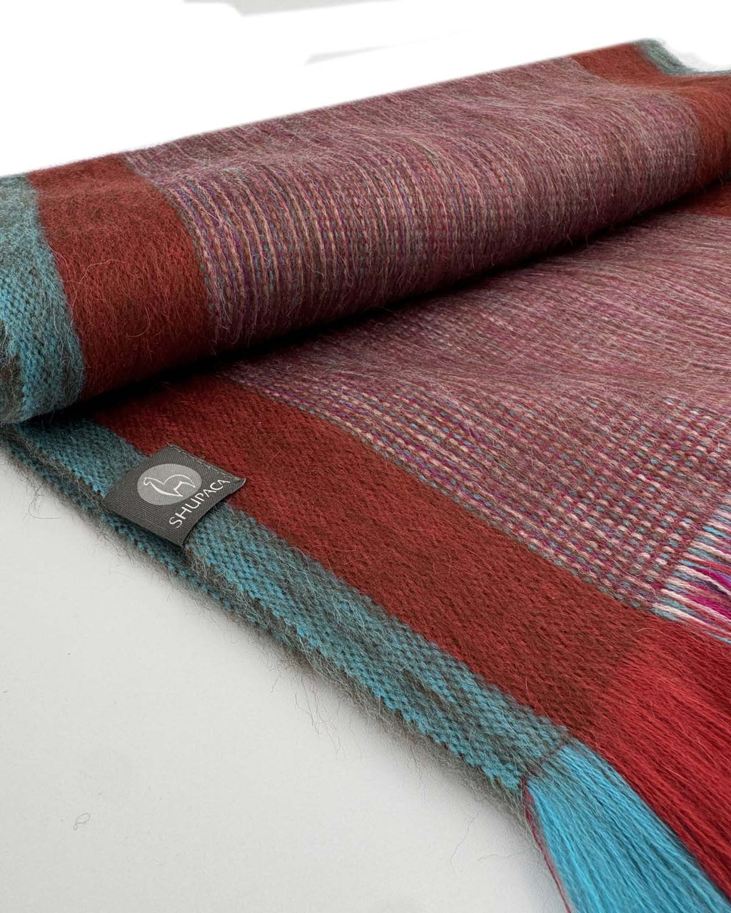 Red alpaca scarf in Wild Poppy with rosewood and aqua stripes, handwoven by Shupaca