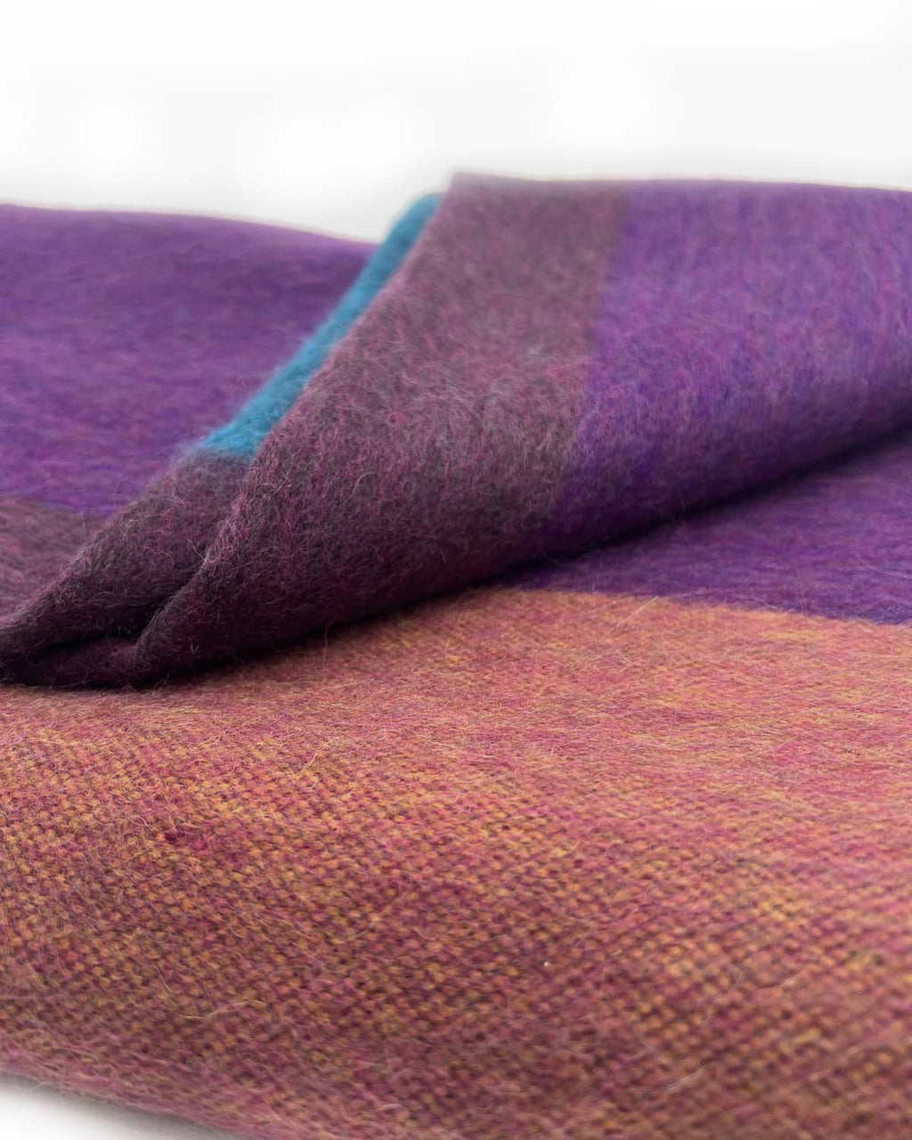 Plum alpaca throw blanket in Grapevine with berry and teal accents, Shupaca