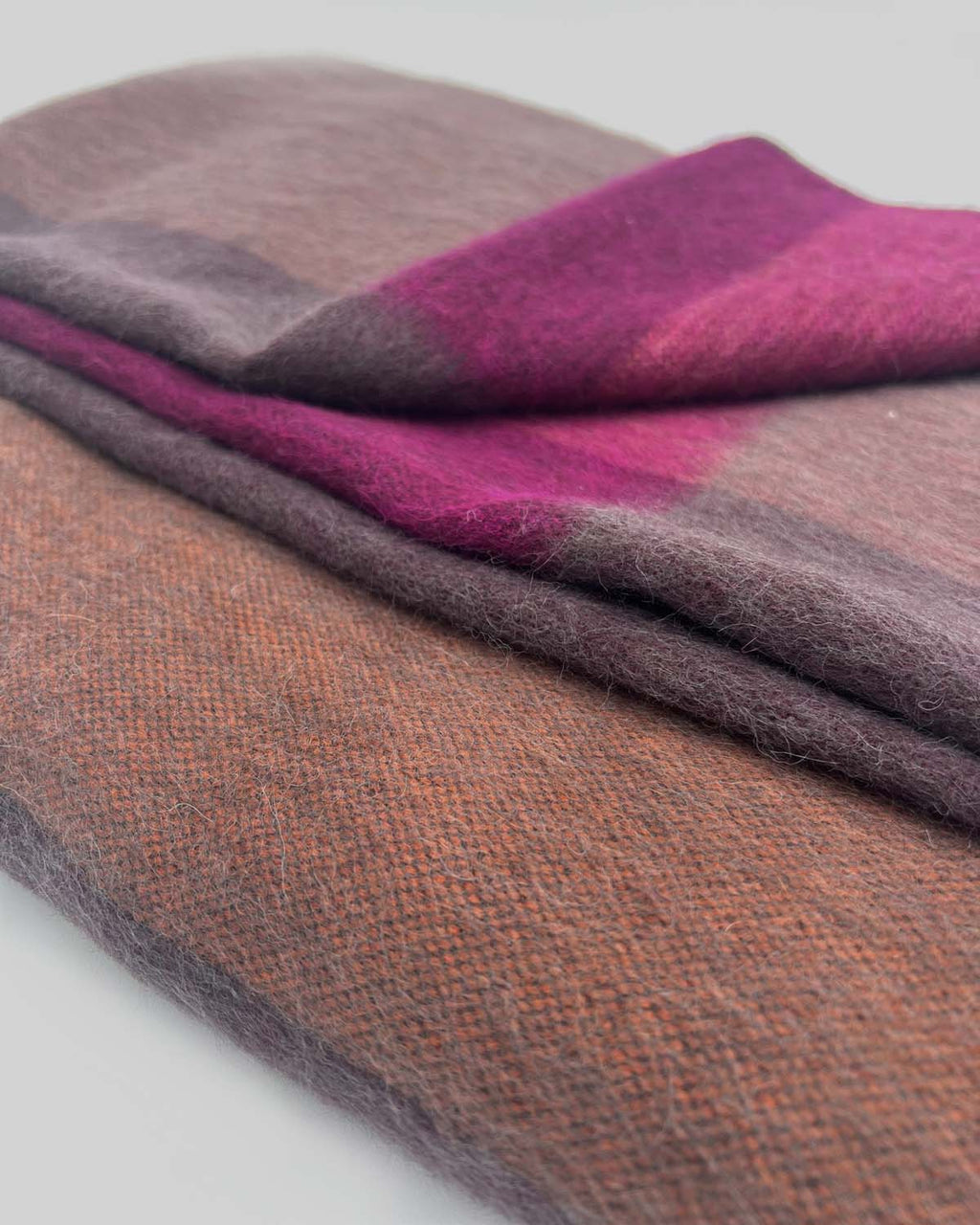 Plum alpaca throw blanket in Sunset with rosewood and magenta blocks, Shupaca