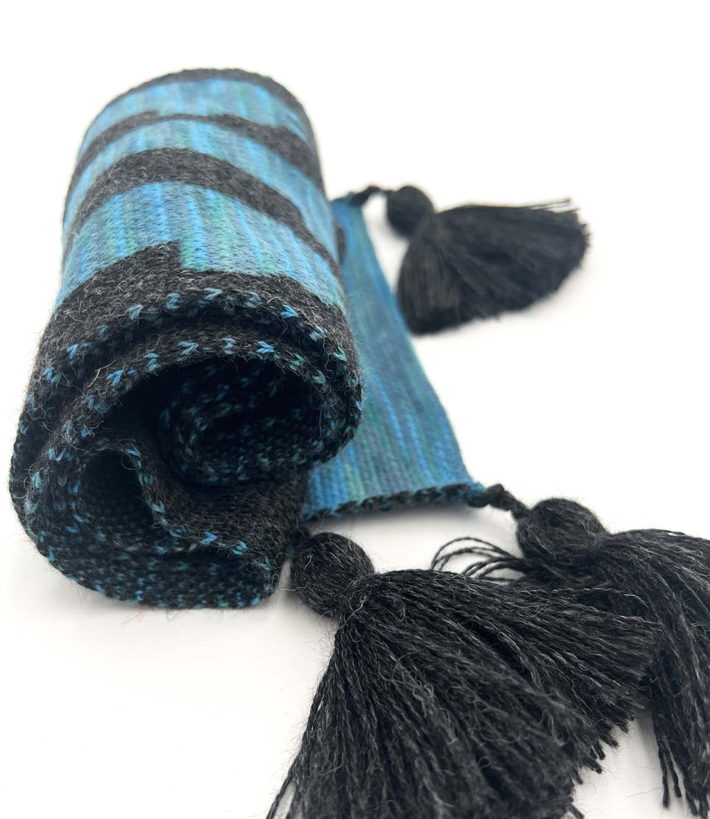 Aqua Paca kid's alpaca scarf with alpaca pattern and tassels, Shupaca