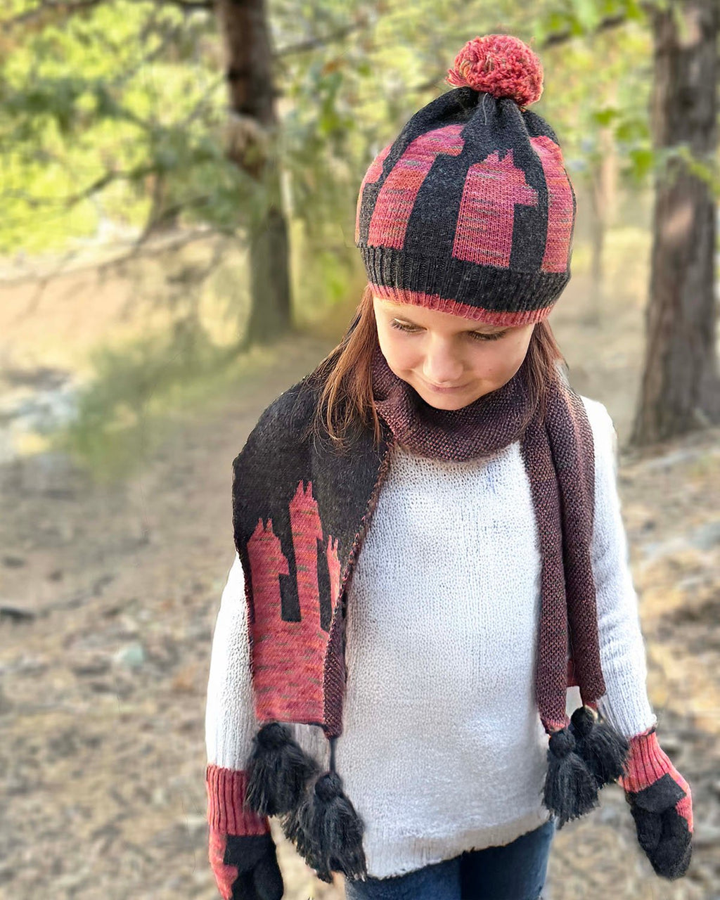 Pink kid's alpaca scarf in Rosey Paca with paca silhouettes and tassels, Shupaca